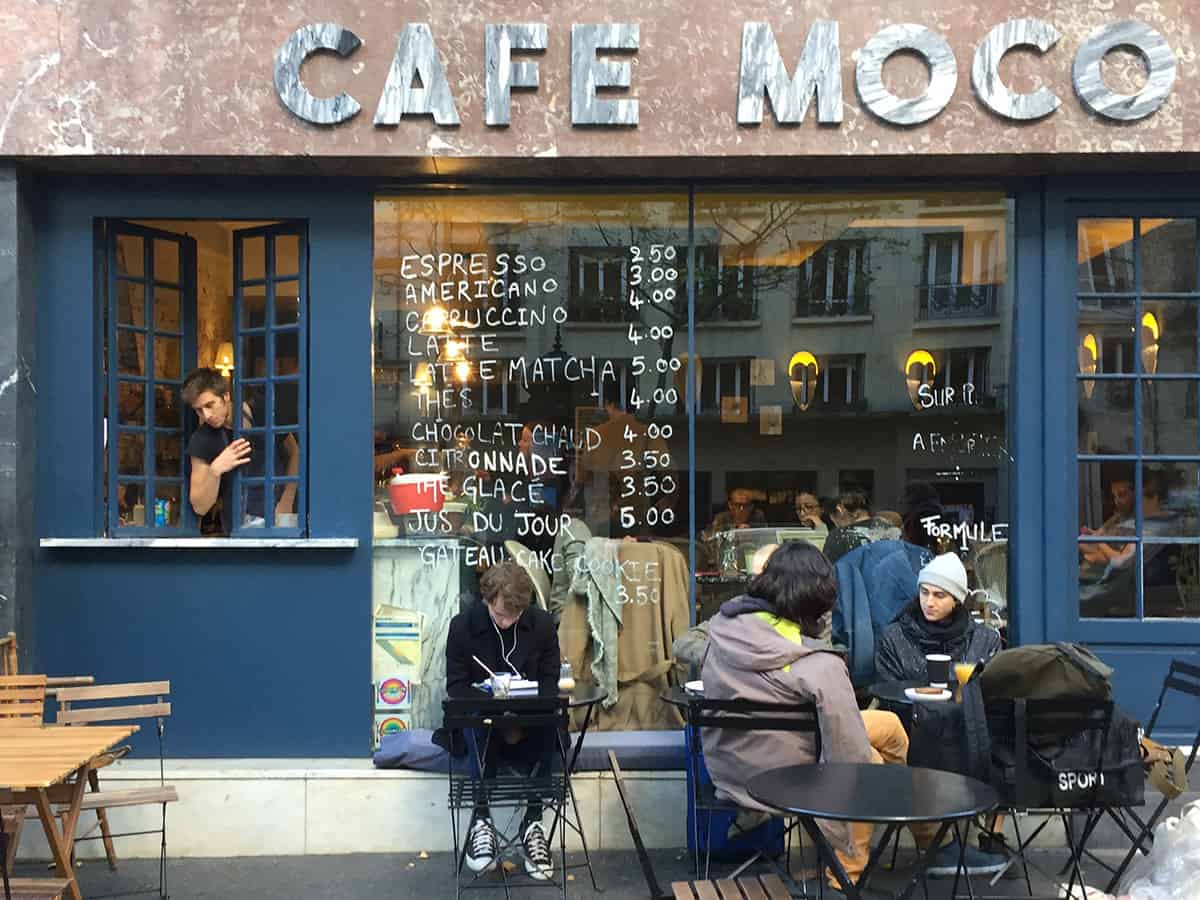 the exterior of a cafe in paris