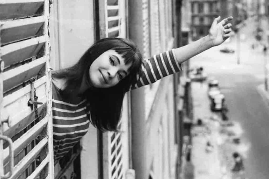 a girl in a striped top in a vintage image of paris