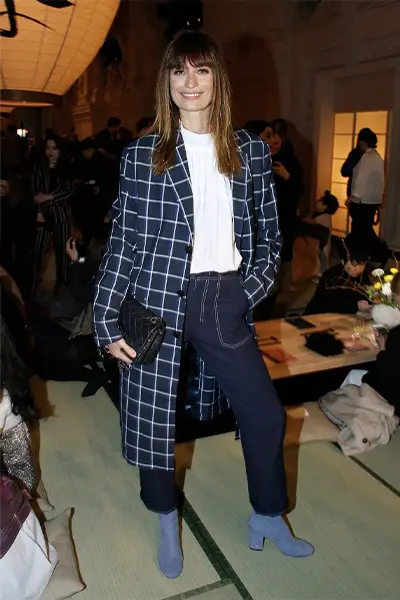 caroline de maigret in a long coat