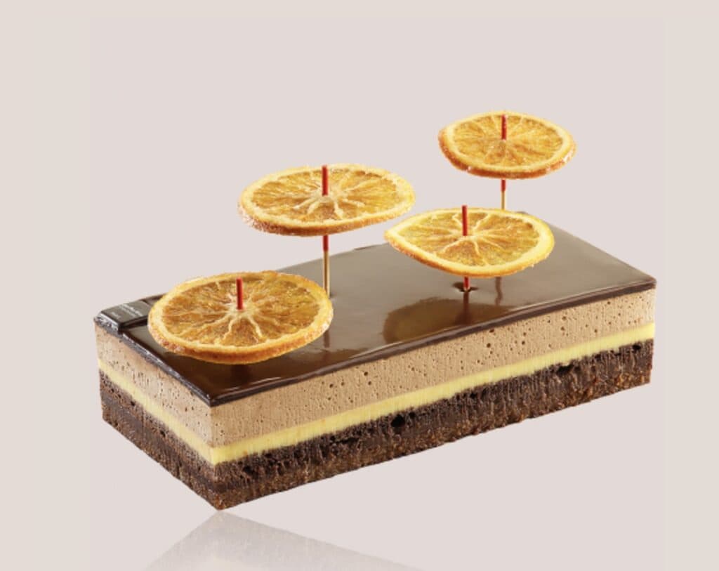 best chocolate in paris - image of chocolate cake with candied orange wheels