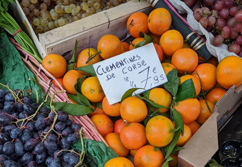 french food market - clementines and grapes