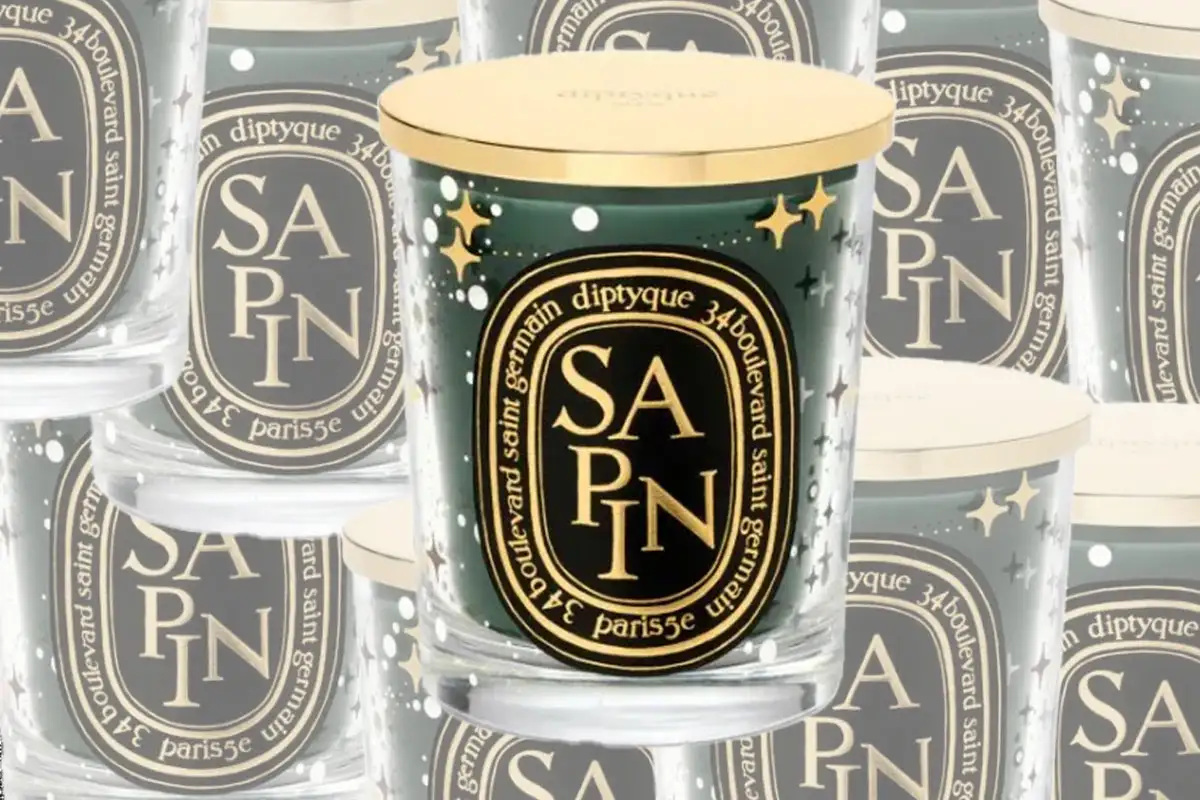 sapin candle from diptyque shown in front of array of other sapin candles