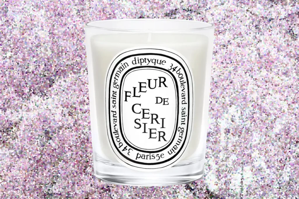 diptyque fleur de ceriser review - image of vessel on field of cherry blossoms