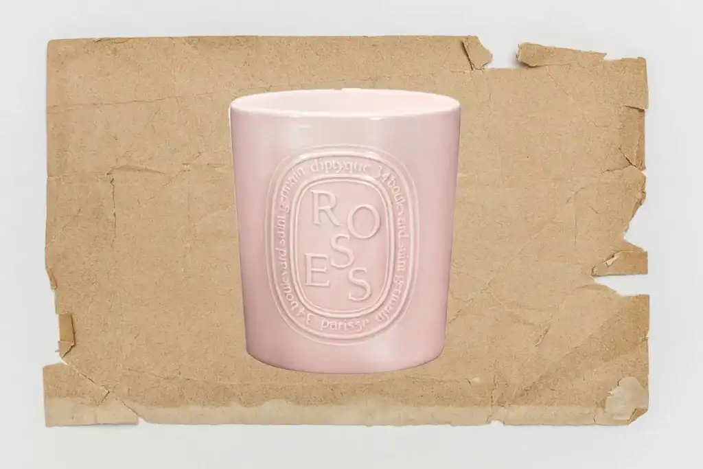 diptyque very large candles - image of rose candle on kraft paper background