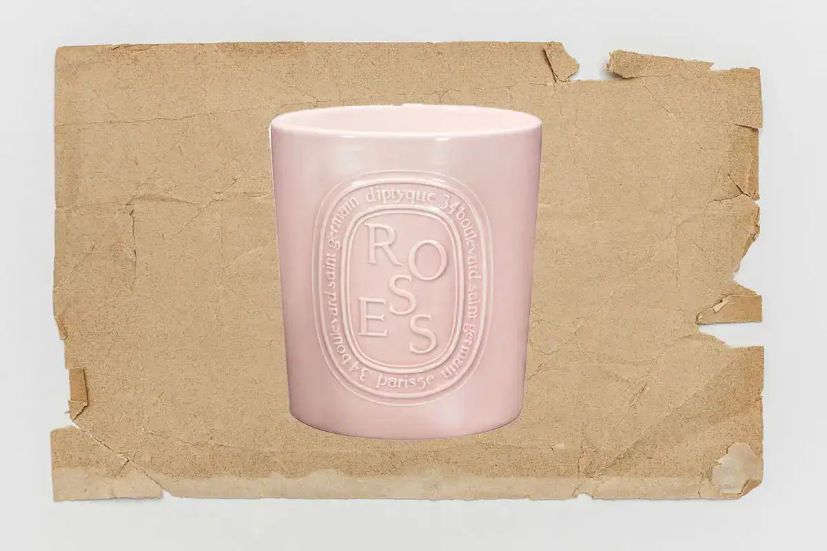 diptyque very large candles - image of rose candle on kraft paper background