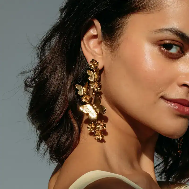 jennifer behr gold butterfly galilea earrings shown on model