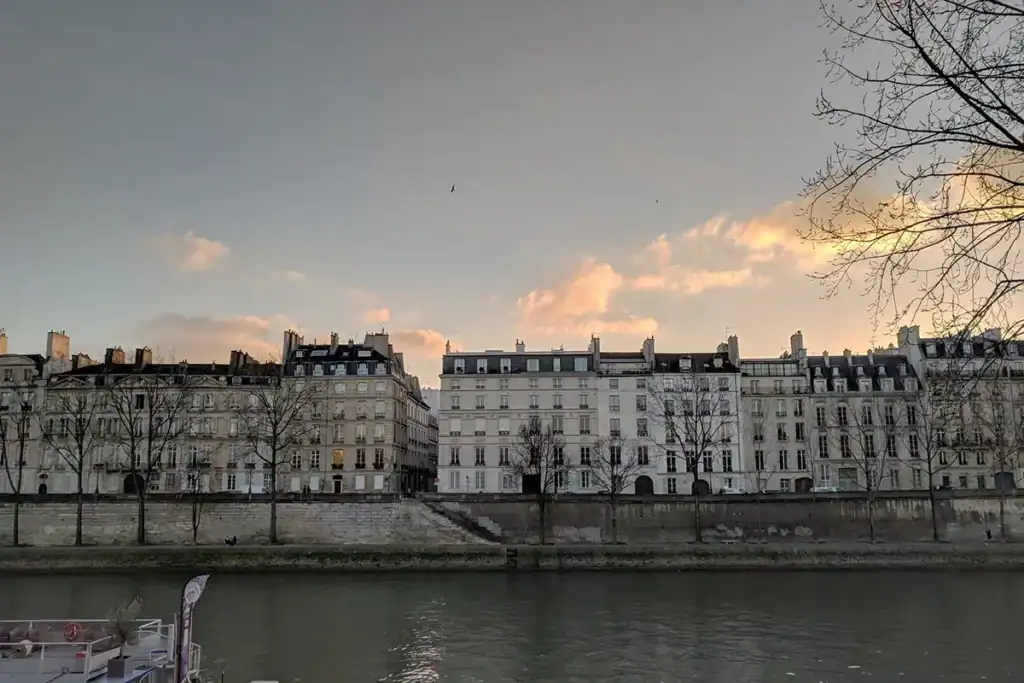 scene of paris in january with buildings along the seine