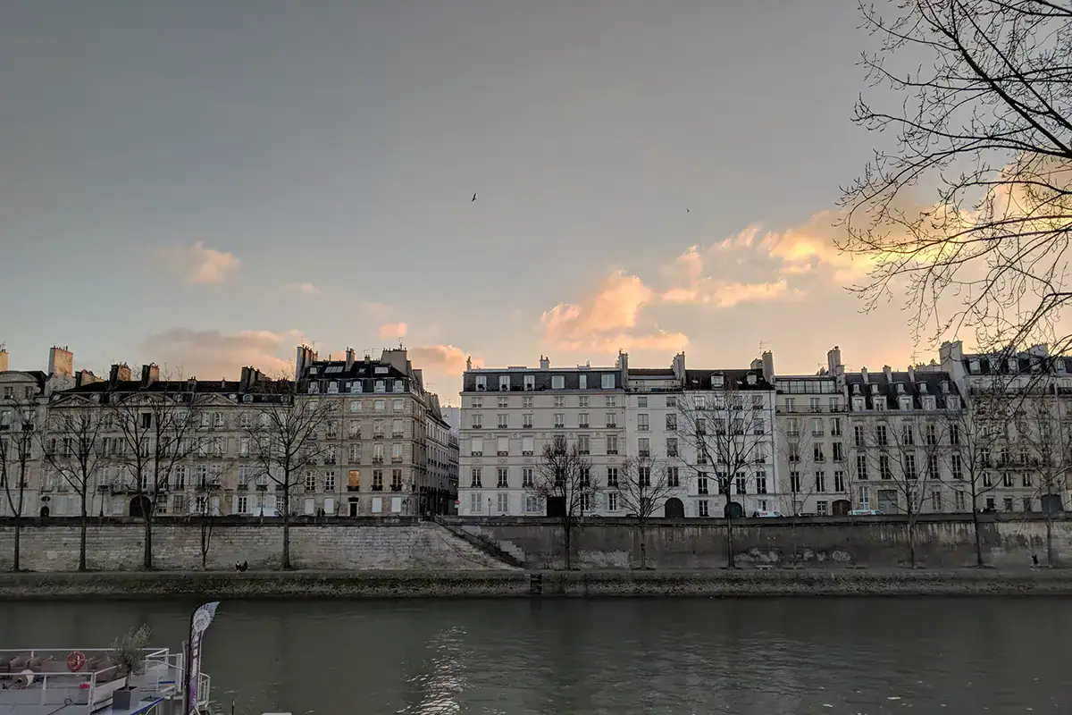 scene of paris in january with buildings along the seine