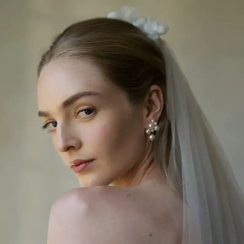 jennifer behr pearl cluster perlita earrings shown on bridal model