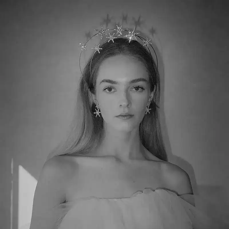 jennifer behr crystal star pluto earrings shown on model